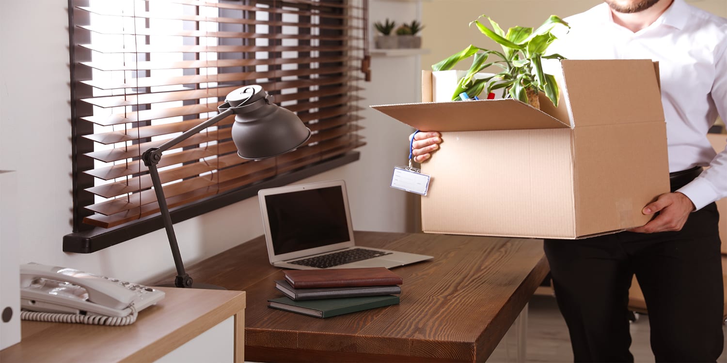 Man packing up home office to relocate and sell house quickly